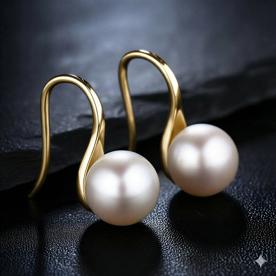 Gold hoop pearl drop earrings with round white pearl