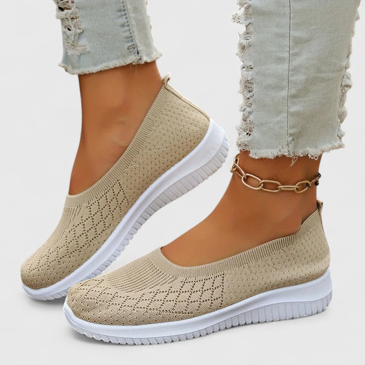 Beige knit slip-on sneakers with white sole and ankle chain detail