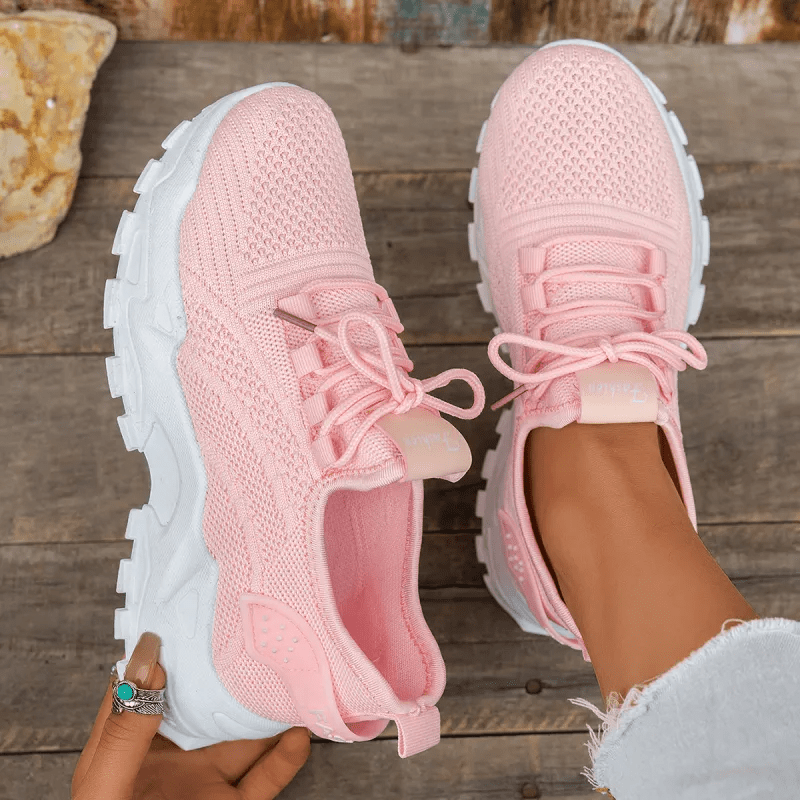 Pink knit comfort sneakers with lace-up front and chunky white sole