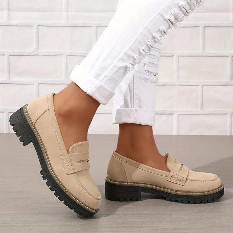 Beige comfort loafers, slip-on design with strap detail and lug tread sole