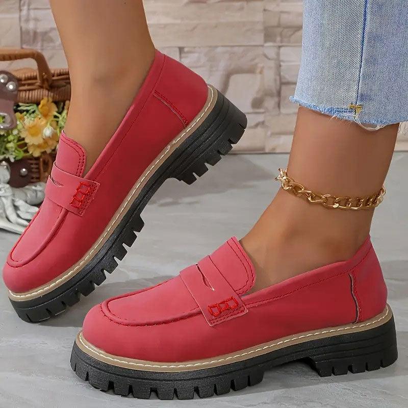 Red comfort loafers with slip-on strap detail and chunky lug sole