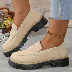 Beige comfort loafers with slip-on strap detail and chunky lug sole