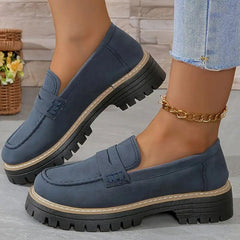 Blue comfort loafers with buckle strap detail and chunky tread sole