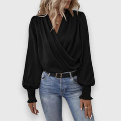 Black long-sleeve satin blouse with cowl V-neck wrap-style front