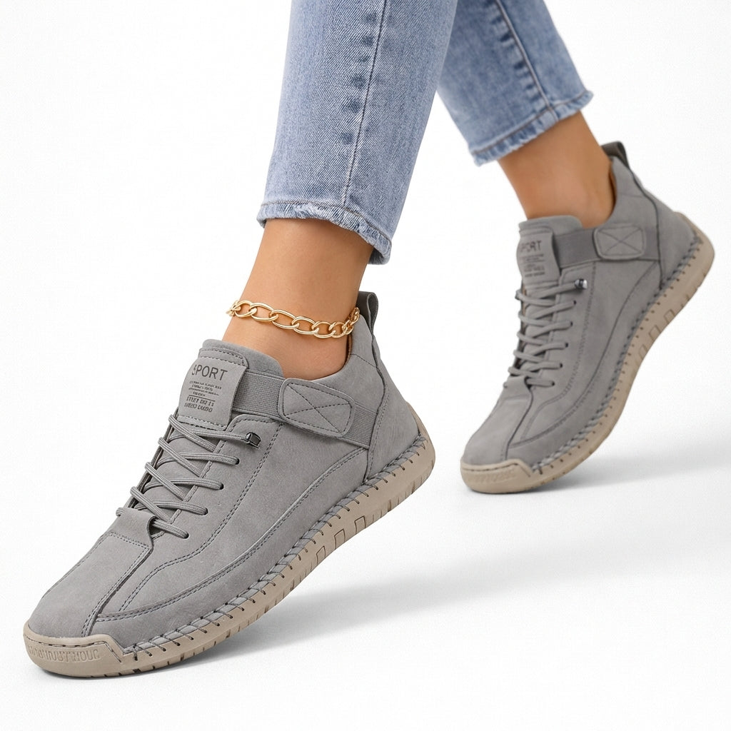 Grey lace-up comfort sneakers with side strap and textured rubber sole