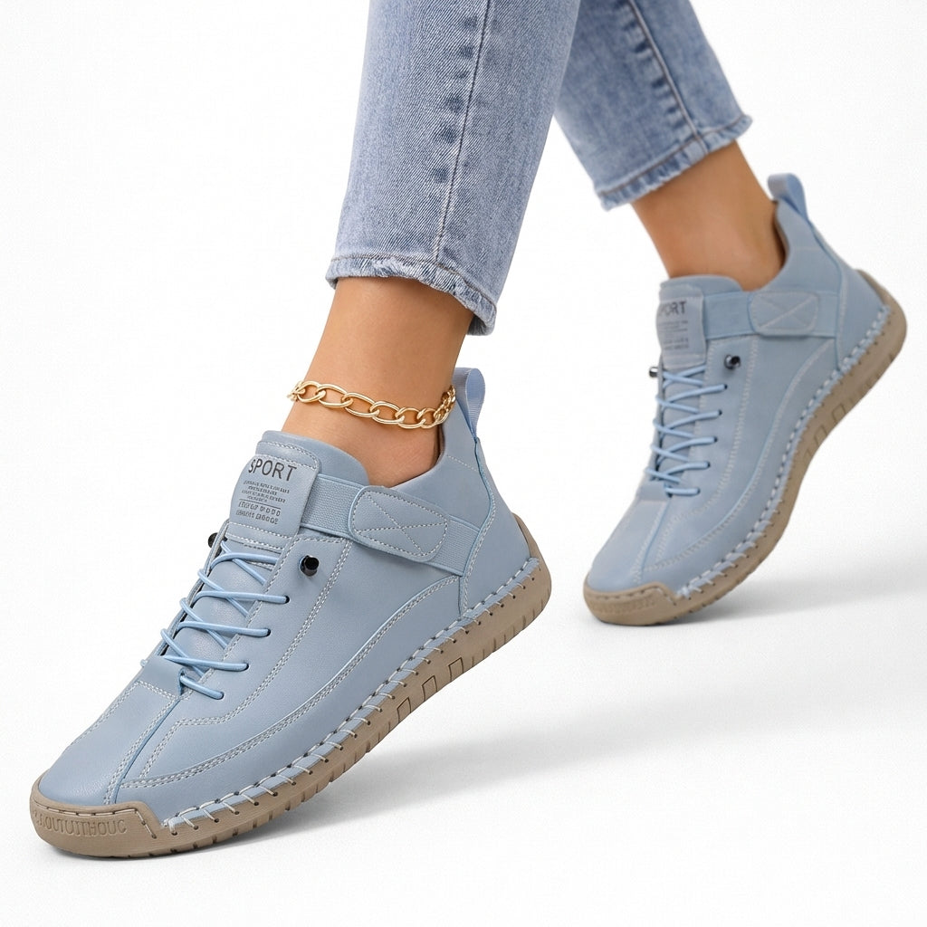Light blue lace-up comfort sneakers with side strap and textured rubber sole