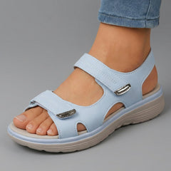 Light blue open-toe sandals with two hook-and-loop straps and padded cushioned sole