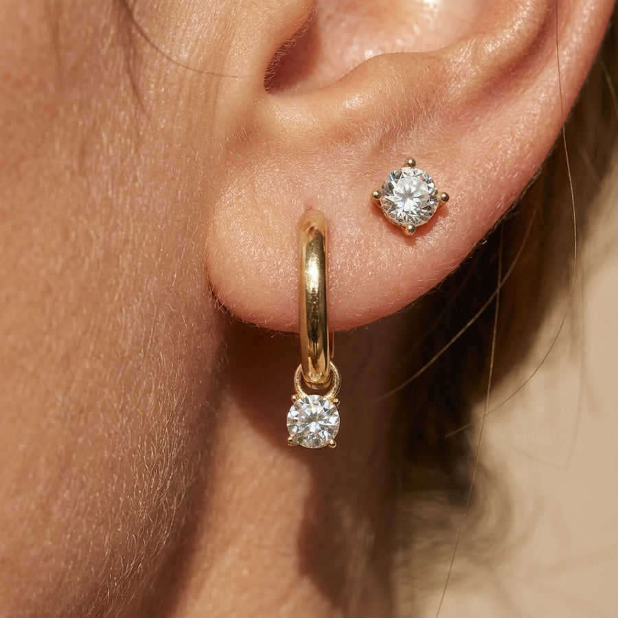 Yellow gold hoop earring with round clear stone and matching round stud