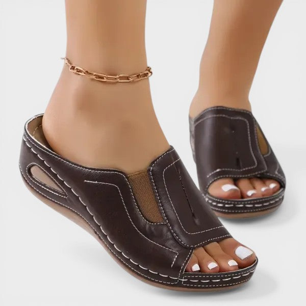 Dark brown open-toe slip-on sandals with two-panel vamp and contrast stitching