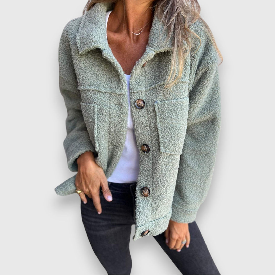 Green sherpa-style button-front coat with flap pockets and spread collar.