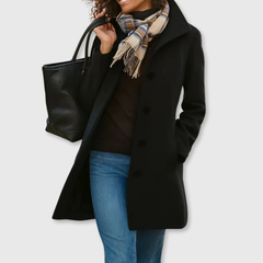 Black long classic coat with four-button front and notched lapels