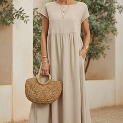 Off-white casual midi dress with short sleeves and gathered waist