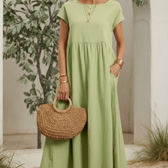 Soft green casual midi dress with short sleeves and gathered waist