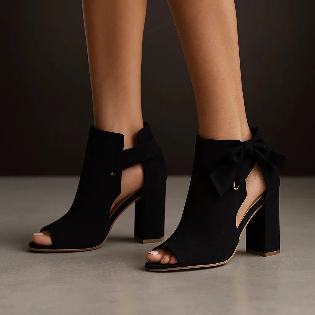 Black heeled peep-toe sandals with ankle bow and thick block heel