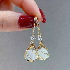 Gold opal drop earrings with teardrop opal charms and small crystal accents
