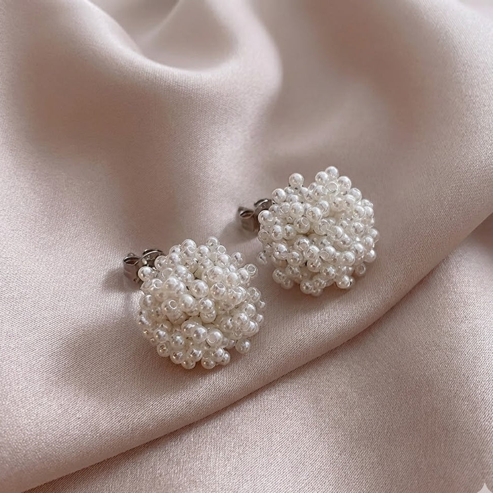Inlaid pearl cluster earrings with round textured white beads and silver-toned backs