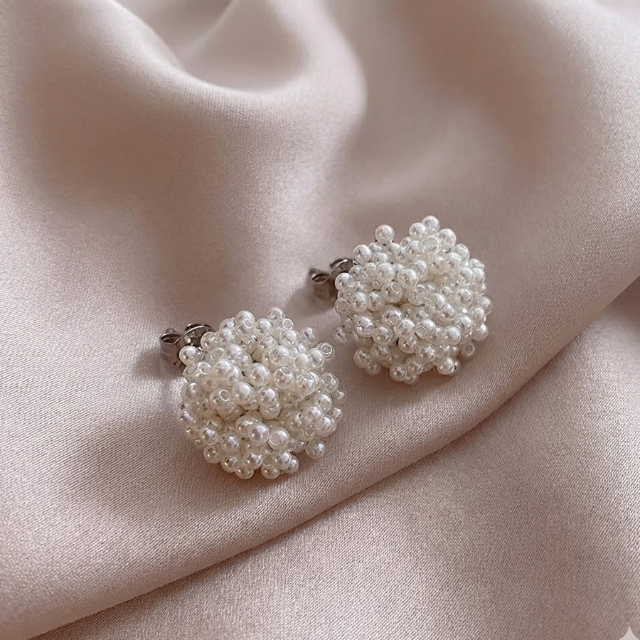 Inlaid pearl cluster earrings with round textured white beads and silver-toned backs