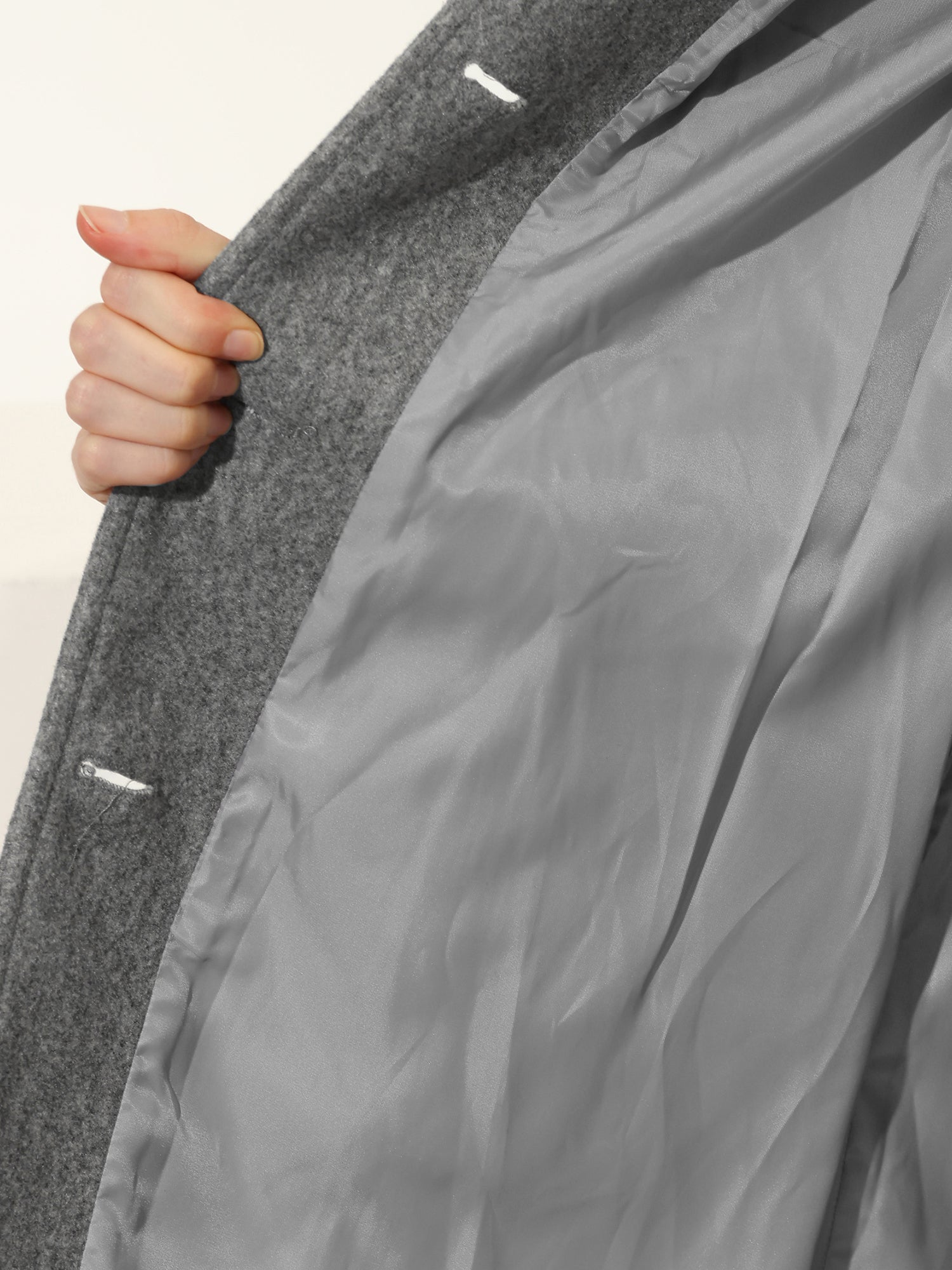 Gray winter trench coat with interior lining and snap-button placket