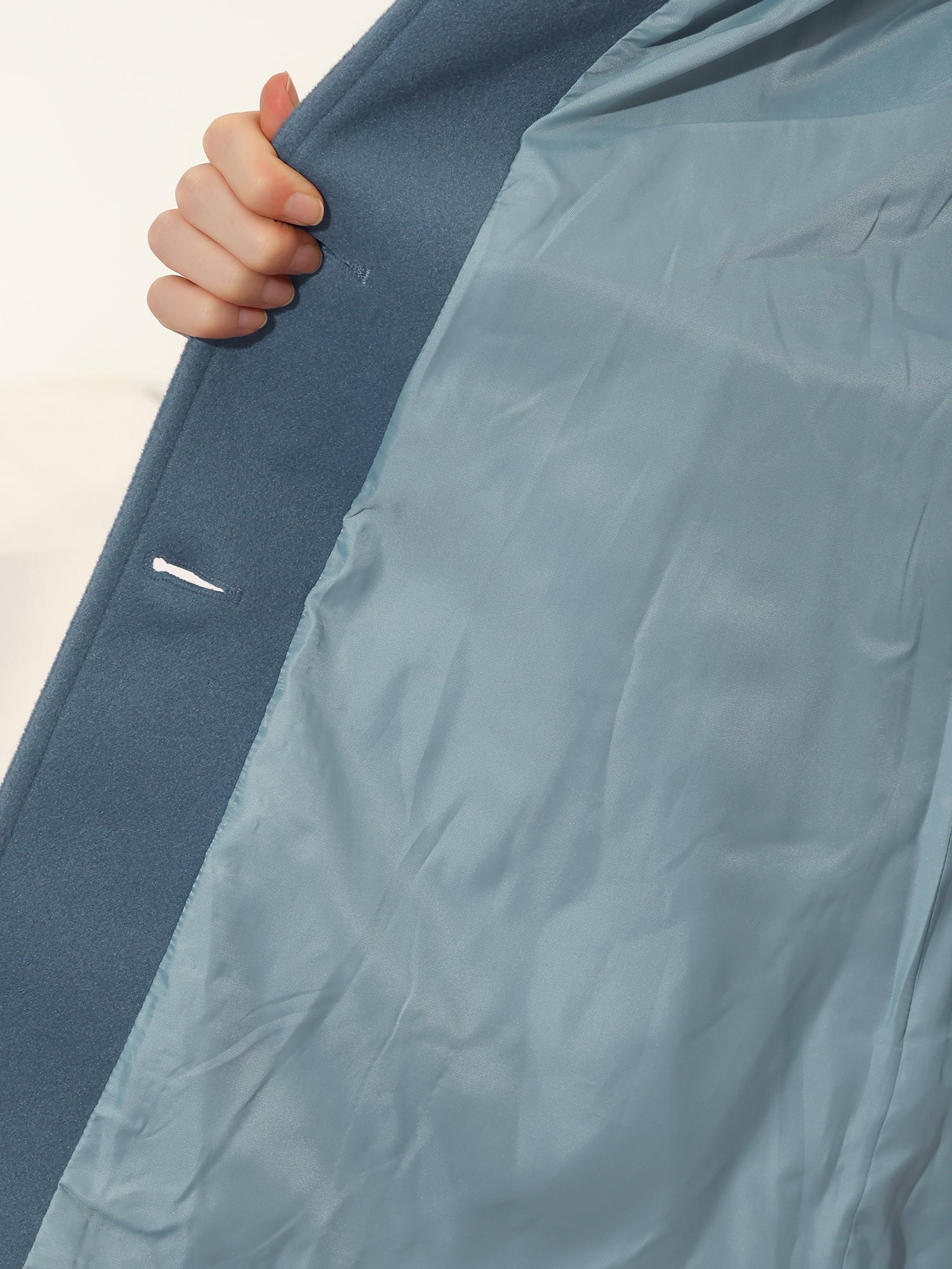 Blue winter trench coat with interior lining and snap-button placket