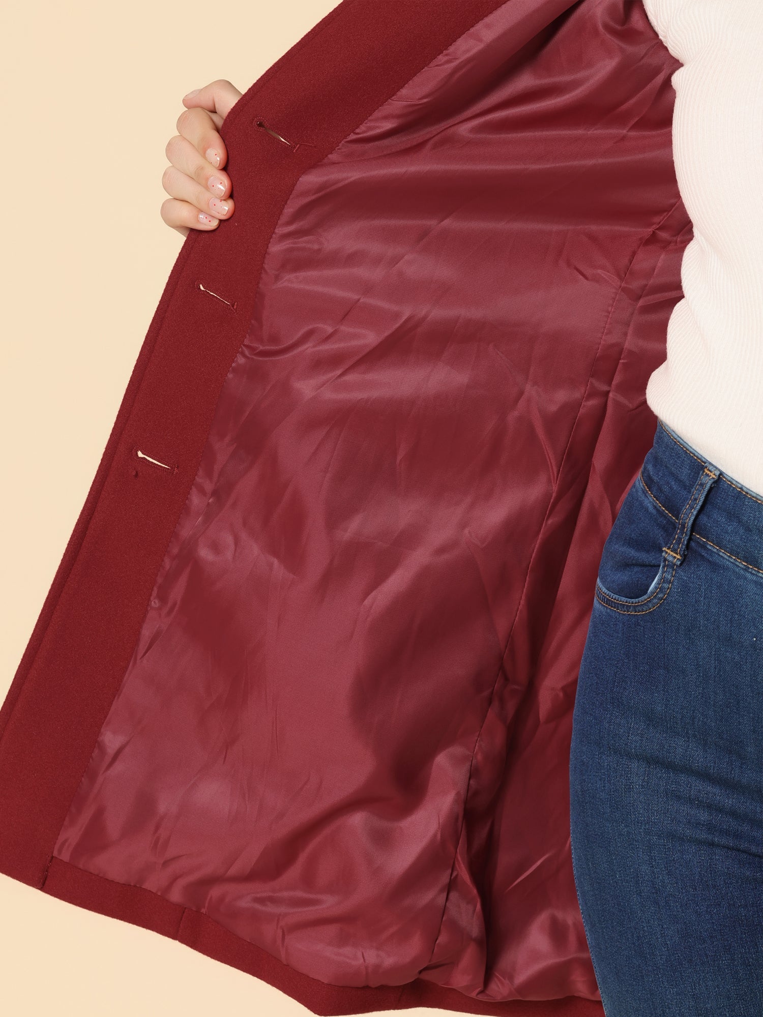 Burgundy trench coat inner lining view with button details and welt pockets